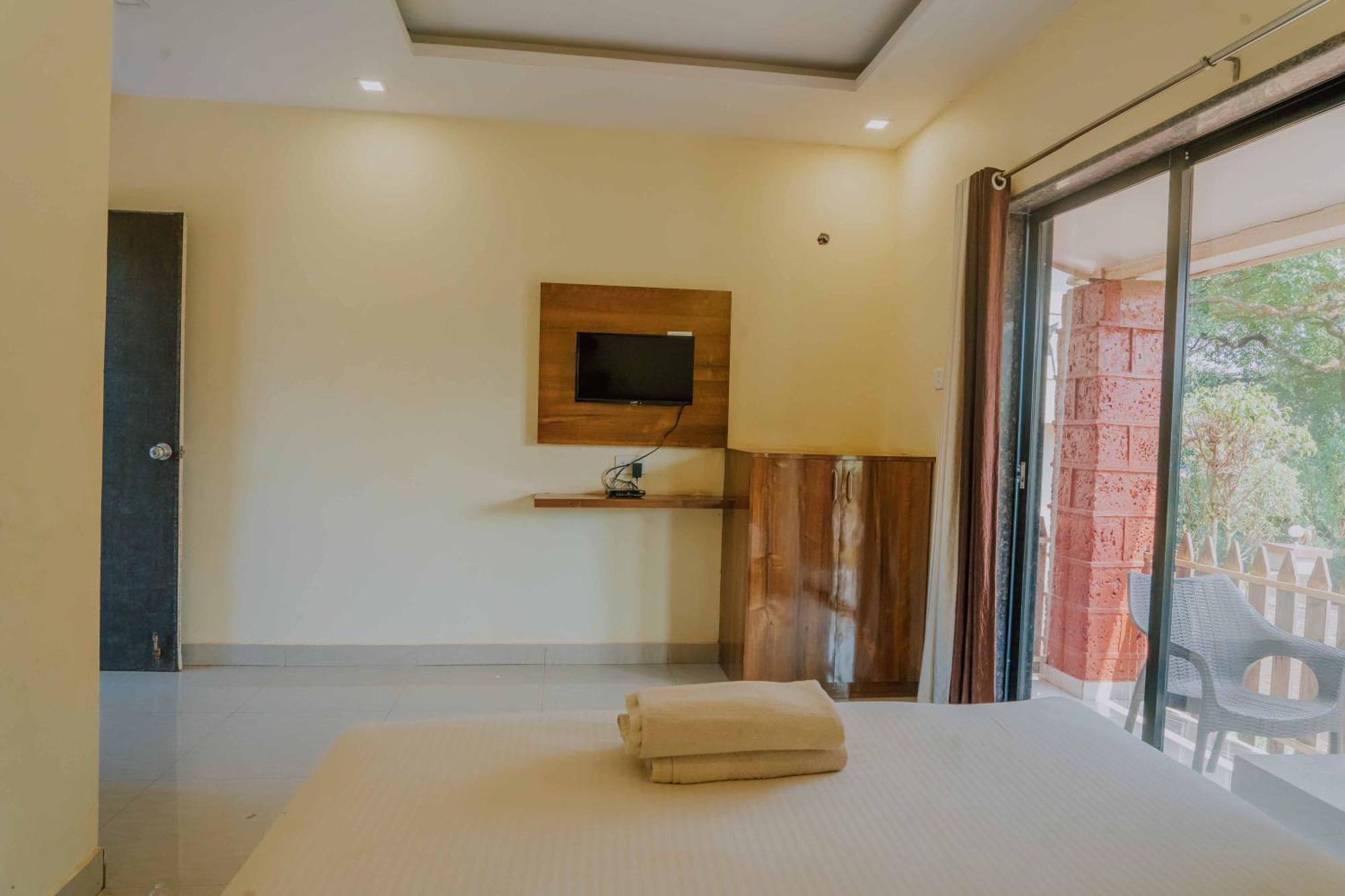 Hotel Oakwood Mahābaleshwar Quarto foto